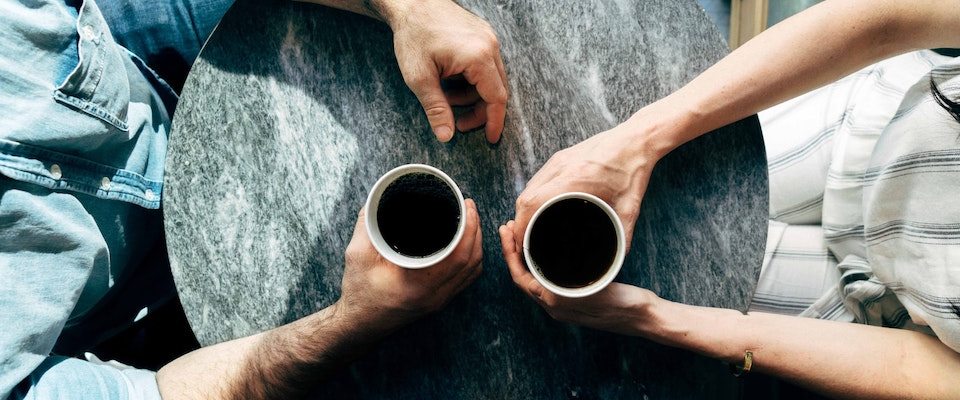 Two people having coffee